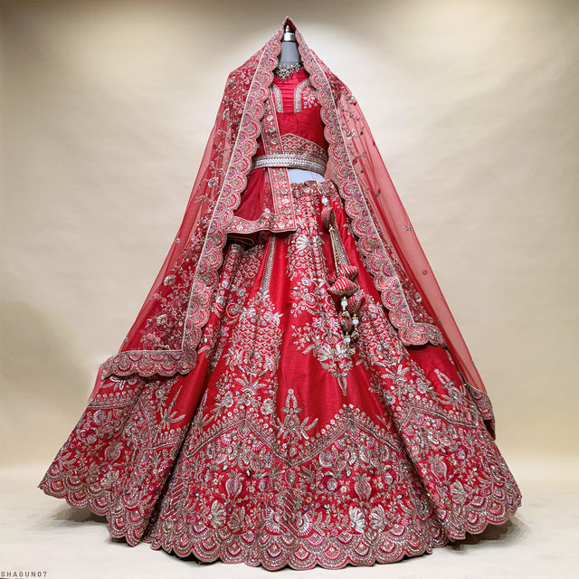 Red and silver embroidered bridal lehenga with layered yoke and sheer dupatta