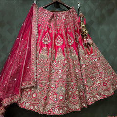 Rani pink bridal lehenga with heavy silver-gold embroidery, bead and cutdana motifs