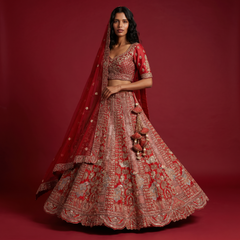 Red bridal lehenga with embroidered motifs and sheer dupatta