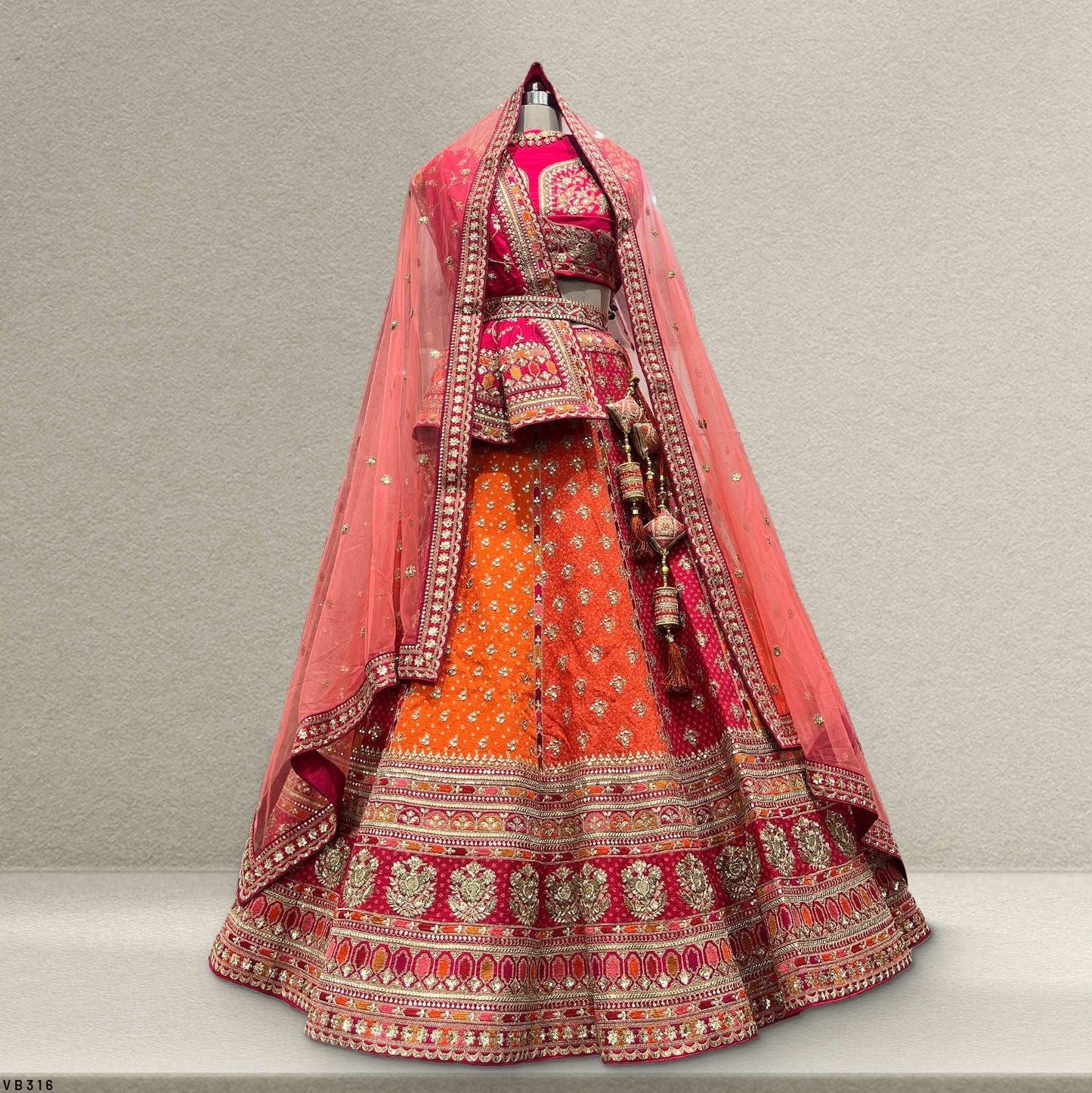 Dulhan in Orange Lehenga Elegance: Celebrity-Inspired Royal Baggi Collection