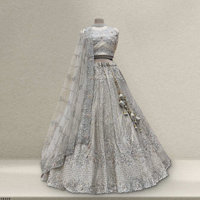 Pearl white embroidered lehenga with sheer dupatta and beaded tassel detailing