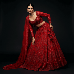 Red sequined lehenga with matching draped dupatta and beaded waistband