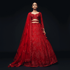 Red sequined lehenga set with cropped blouse and sheer draped dupatta