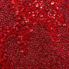 Close-up of red sequins and embroidery on lehenga fabric