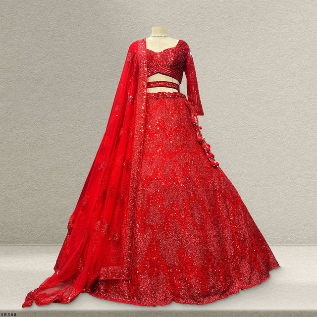 Red sequin lehenga set with fitted blouse and matching embellished dupatta