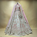 Embroidered pastel lehenga with silver detailing, light blue skirt, pink and maroon motifs