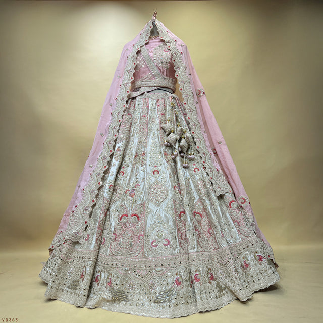 Embroidered pastel lehenga with silver detailing, light blue skirt, pink and maroon motifs