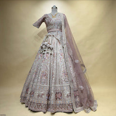 Pastel bridal lehenga set with patterned skirt, sequined trim, and sheer dupatta