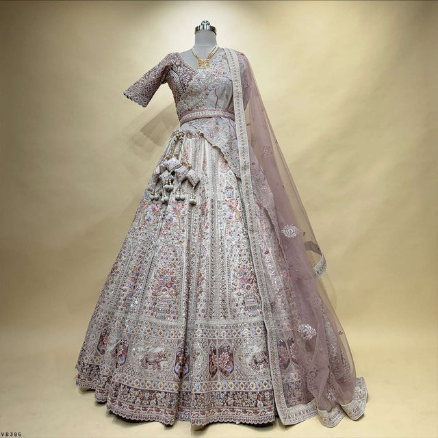 Pastel bridal lehenga set with patterned skirt, sequined trim, and sheer dupatta