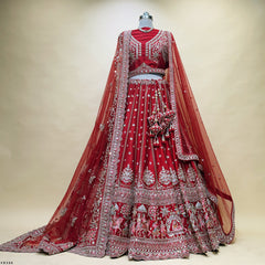 Bridal lehenga with deep red net dupatta and silver beaded embroidery, flared skirt