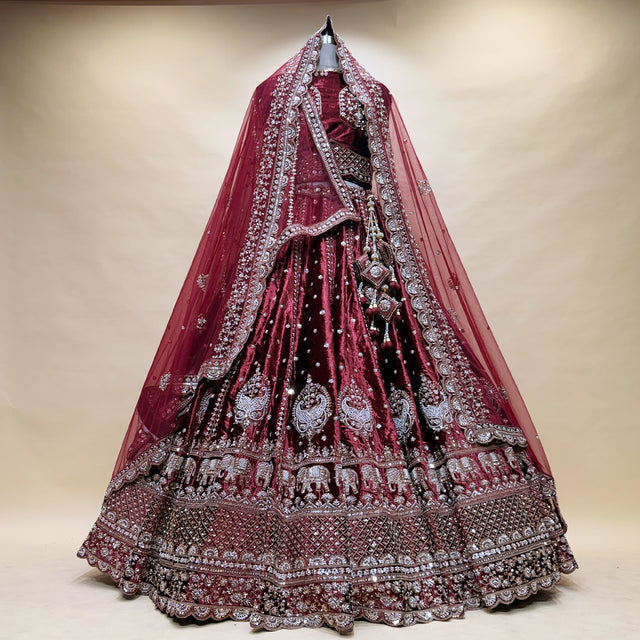 Maroon wedding lehenga with detailed silver motif yoke, full flare and dupatta