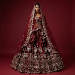 Maroon wedding lehenga with embroidered bodice, full skirt, and double dupatta