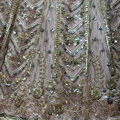 Beaded lehenga fabric with chevron motifs, sequins, and small stone embellishments
