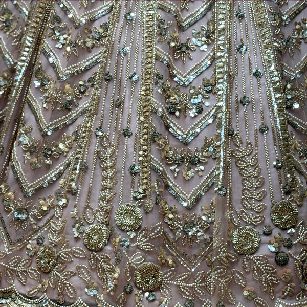Beaded lehenga fabric with chevron motifs, sequins, and small stone embellishments