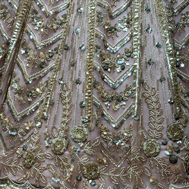 Beaded lehenga fabric with chevron motifs, sequins, and small stone embellishments