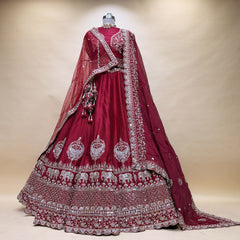 Maroon bridal lehenga with silver bead border, elephant motifs, flared skirt