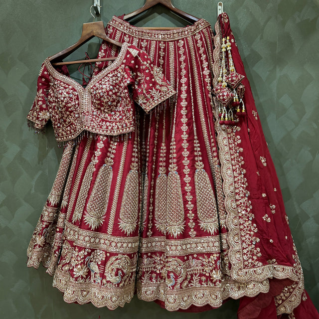 Maroon bridal lehenga skirt with gold zari motifs and matching double dupatta