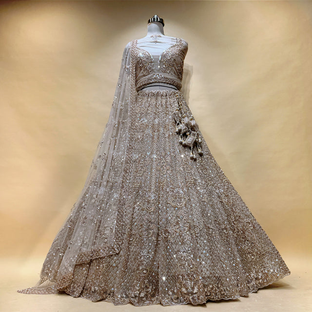 Champagne gold sequin lehenga with embroidered blouse and sheer embellished dupatta