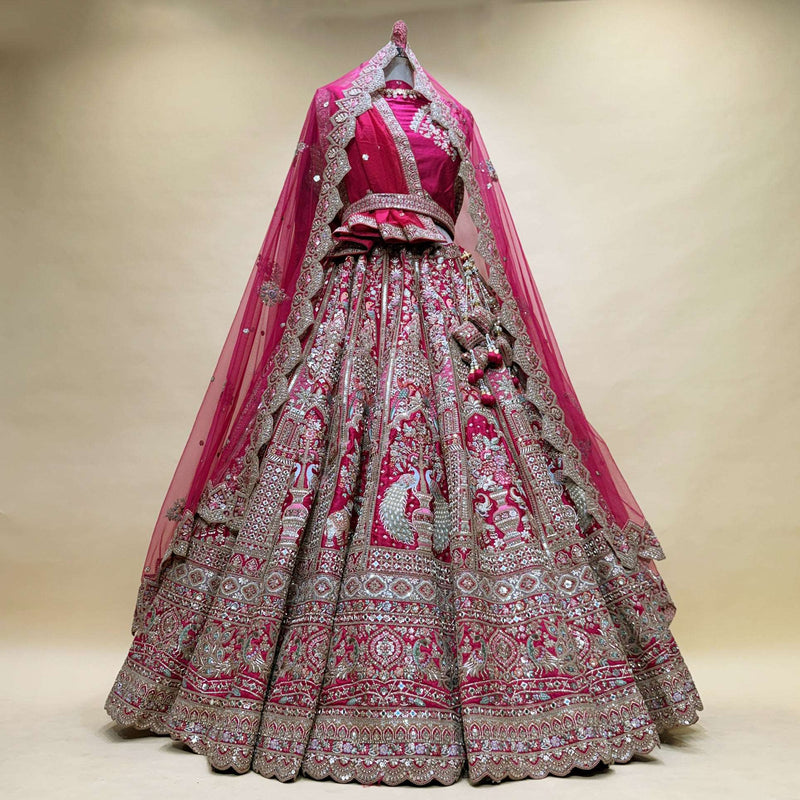 Pink designer bridal lehenga with silver mirror handwork and ornate tiered skirt