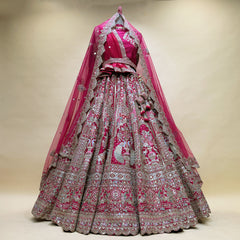 Pink designer bridal lehenga with mirror work, ornate silver embroidery and flared skirt