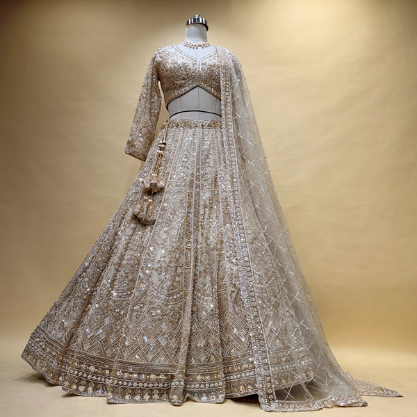Ivory and gold beaded bridal lehenga with sheer embroidered net dupatta
