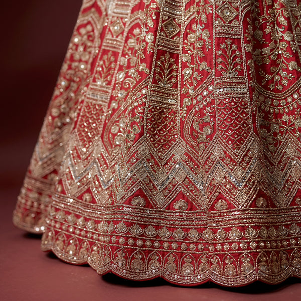 Red and silver embroidered lehenga hem with detailed border and beadwork