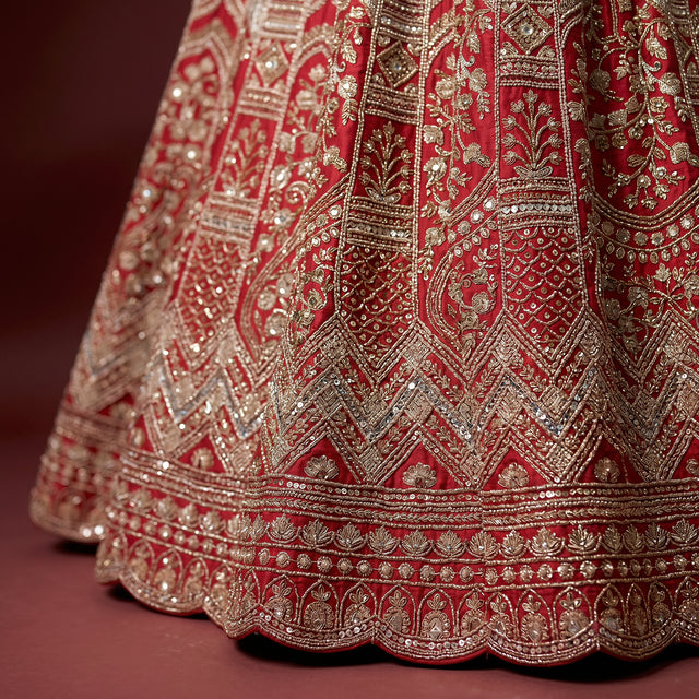 Red and silver embroidered lehenga hem with detailed border and beadwork