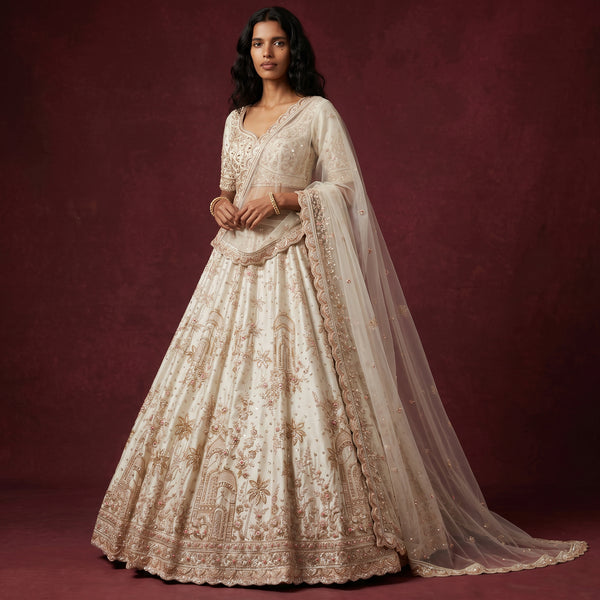 Ivory bridal lehenga with embroidered jharoka motifs, long sleeves, double dupatta