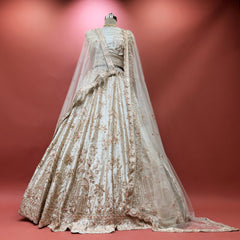 Ivory bridal lehenga with allover embroidery and sheer dupatta drape