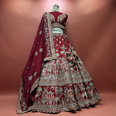 Maroon bridal lehenga with ornate bead and cutdana embroidery, silver border, veil