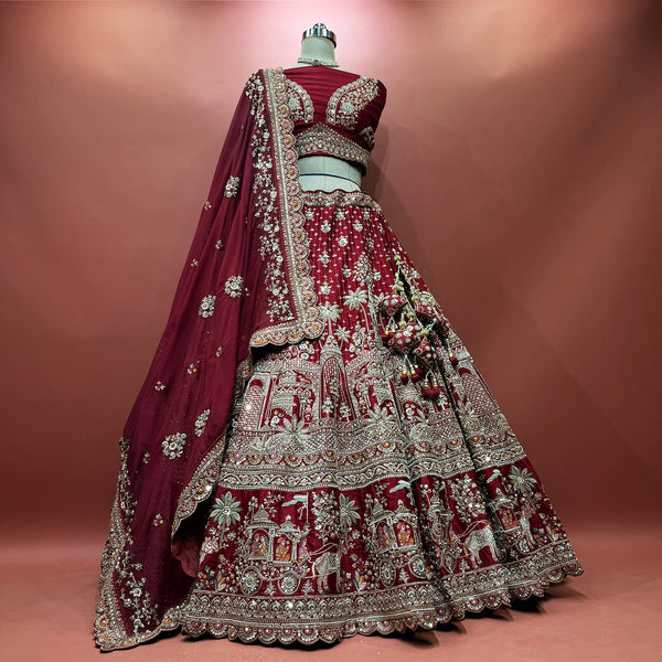 Maroon bridal lehenga with ornate bead and cutdana embroidery, silver border, veil