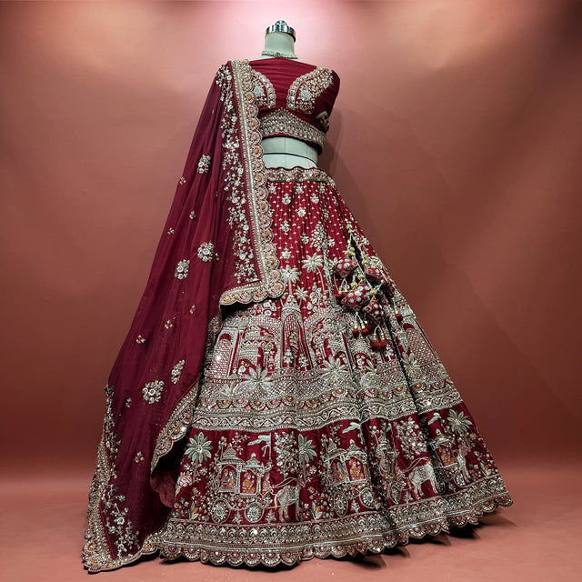 Maroon bridal lehenga with ornate bead and cutdana embroidery, silver border, veil