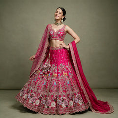 Rani pink bridal lehenga with embroidered floral border and two dupattas