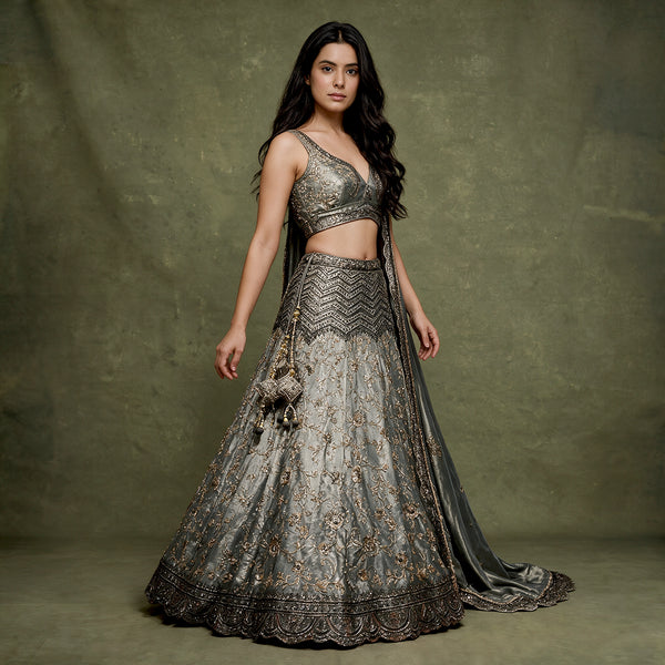 Grey tissue silk lehenga with black cutdana work, flared skirt and embroidered blouse