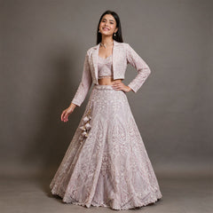 Baby pink net lehenga with beaded cropped jacket, sweetheart blouse and latkans, worn