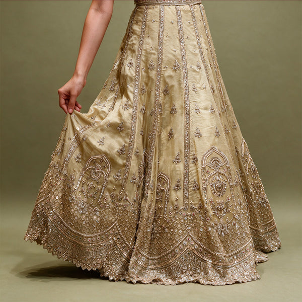 Gold crepe silk lehenga skirt with pearl and bead panel lines, arched hem motifs and scalloped edge