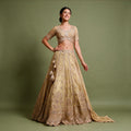 Gold viscose crepe silk handwork lehenga with beaded-fringe blouse and latkans, worn