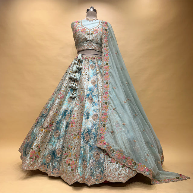 Sky-blue multicolor lehenga set on mannequin, embroidered blouse with flowing organza dupatta