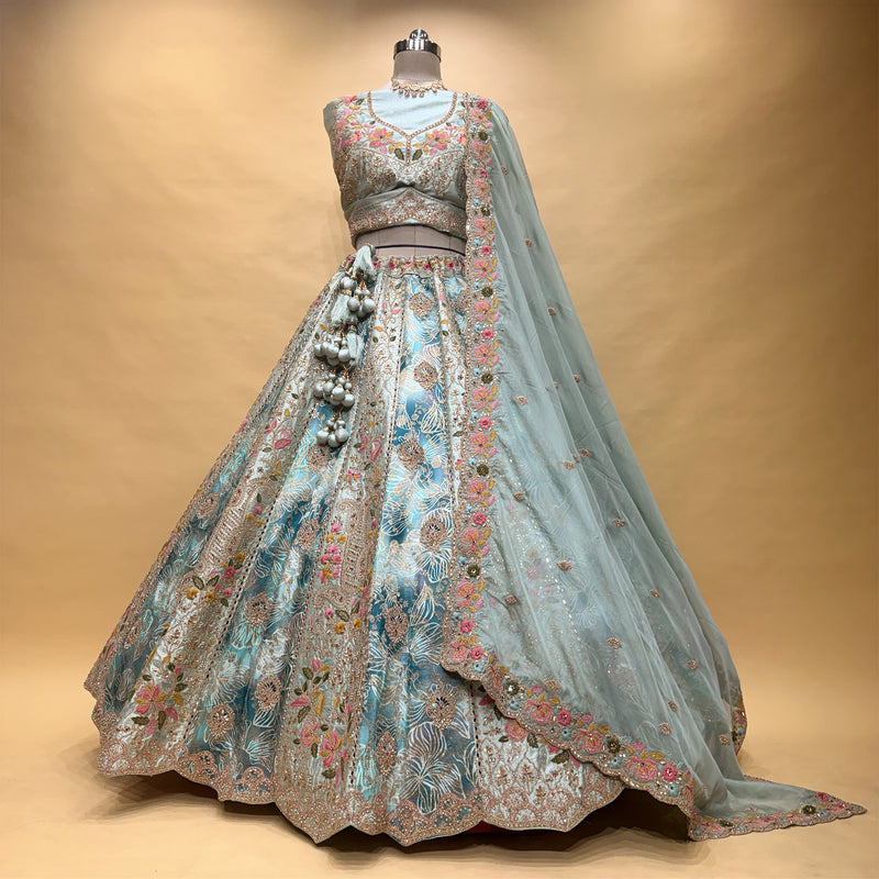 Embroidered multicolor lehenga with blouse and organza dupatta, back view on mannequin