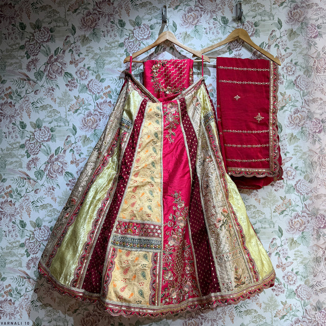 Multicolor patchwork lehenga with green, ivory, and pink panels and ornate trim