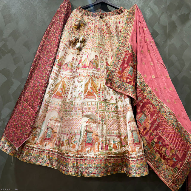Flared cream lehenga skirt with village-style motifs, maroon border, draped dupatta