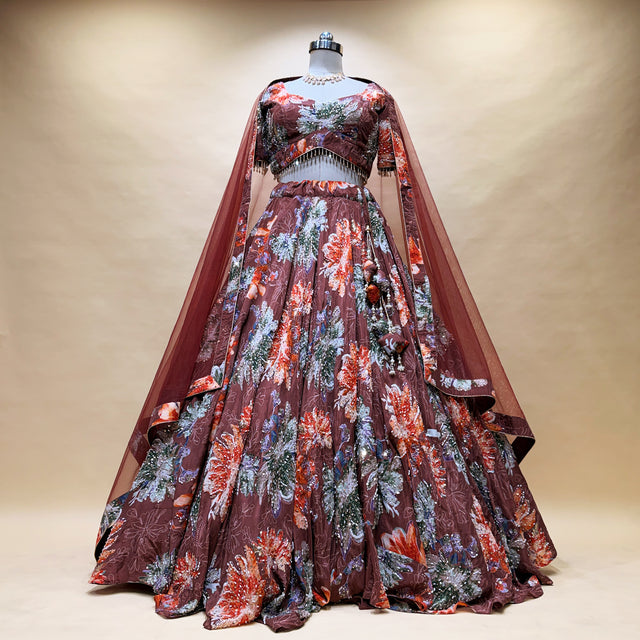 Mocha floral print lehenga set on mannequin with cape and full flared skirt