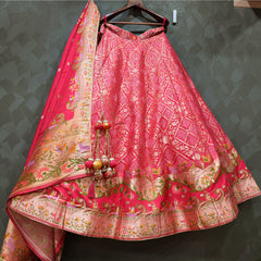 Pink Banarasi-style lehenga with multicolour woven motifs and wide gold border