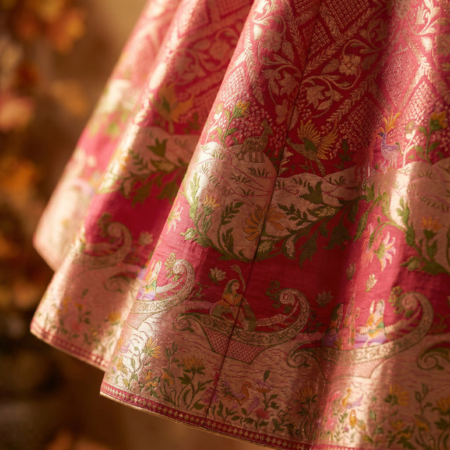 Pink woven lehenga skirt with multicolour floral paisley border