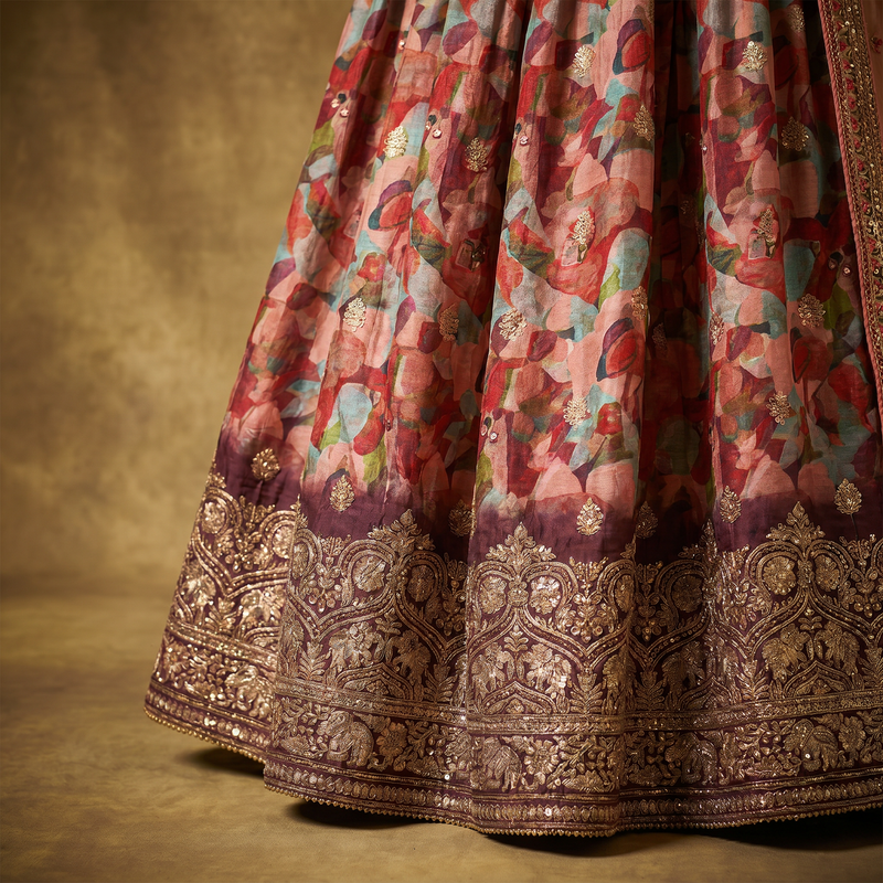 Floral print lehenga skirt hem with ornate gold embroidered border