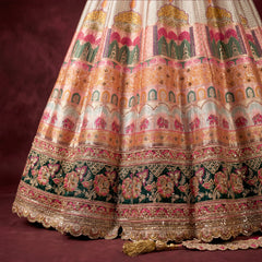 Multicolour Banarasi-style silk lehenga skirt with ornate gold border and motifs