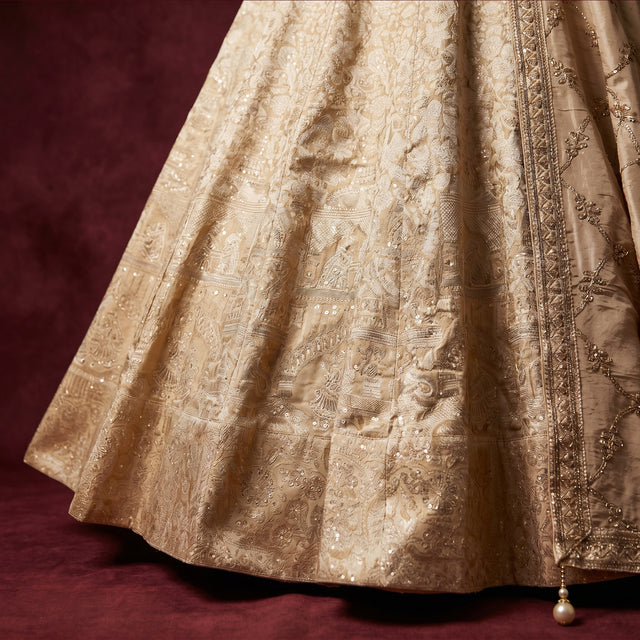 Ivory Banarasi lehenga skirt with ornate brocade motifs and border trim
