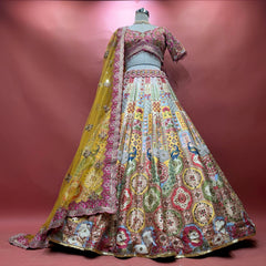 Multicolour Banarasi fusion lehenga with pastel jharokha panels, blue peacocks, medallion tiles and a yellow net dupatta