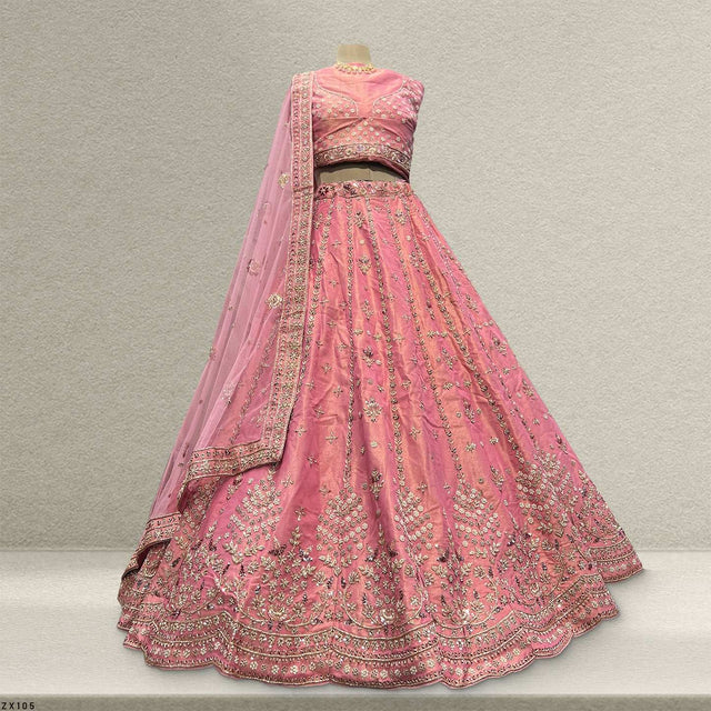 Pink lehenga skirt and fitted blouse with dense gold zardosi work and embroidered hem