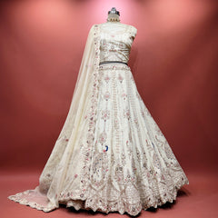 Ivory bridal lehenga with embroidered peacock motif and zardozi beadwork, full skirt